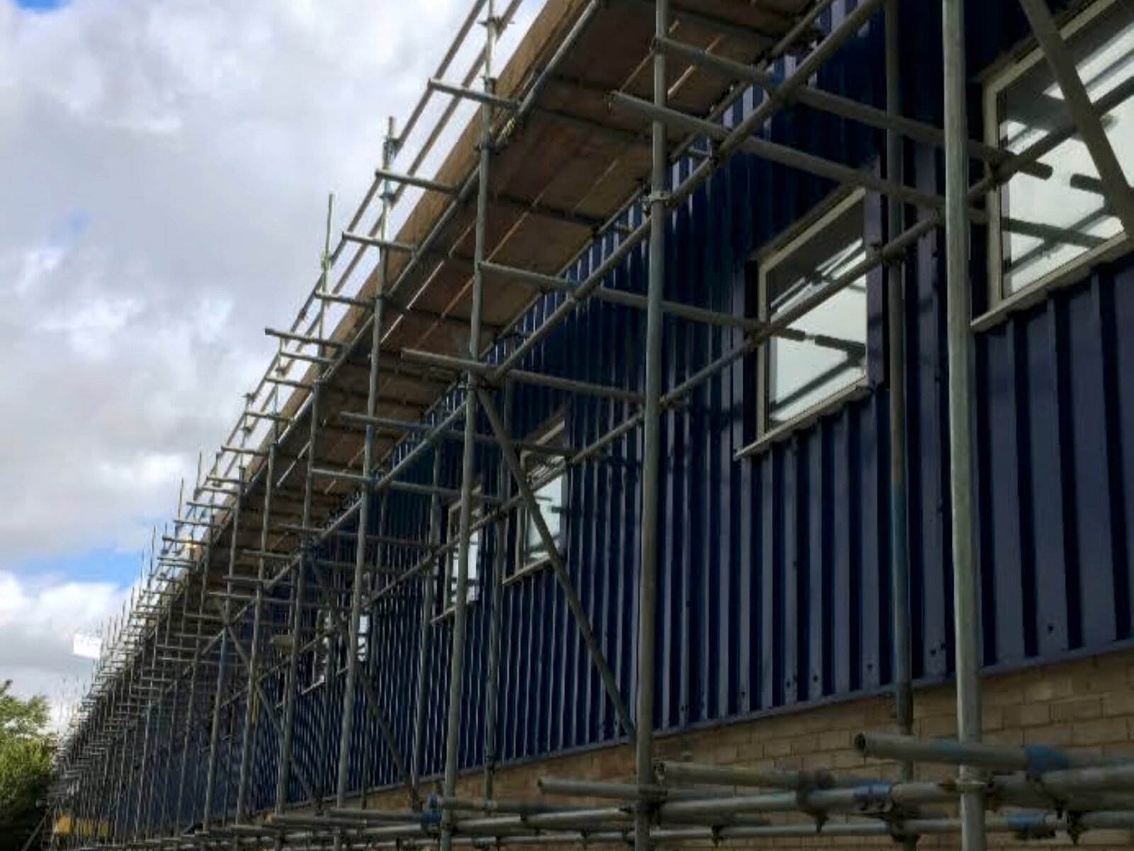 Industrial scaffolding erected by A-Line Scaffolding along a commercial warehouse in Abingdon, Oxfordshire, and the UK